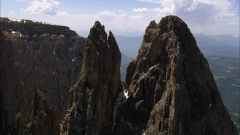 Aerial of snow covered rocky mountain ranges, Flying through mountain peak Stock Footage 109154953