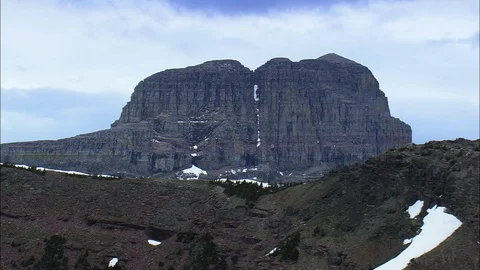 Aerial of snowy mountain cliffs, Iconic mountain, Montana Stock Footage 109454875
