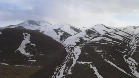 Aerial snowy mountains Stockbeeldmateriaal 240121724
