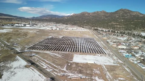 Aerial of solar array in Buena Vista Colorado in winter Stock Footage 295975013