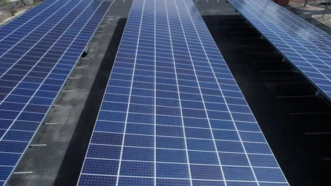 Aerial of a solar panel covered parking lot Stock Footage 235346554