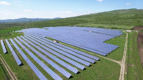 Aerial of a solar panel field on a clear spring day Stock Footage 233656344