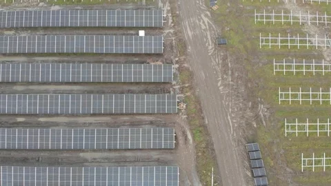 Aerial of Solar Panel Park, Under Construction, Dirt Road, Low Top Down 動画素材 148557076