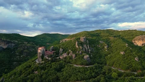 Aerial Speed Ramp Fly Through Rocks to Reveal Great Meteoron Monastery at S.. Stock Footage 334893301