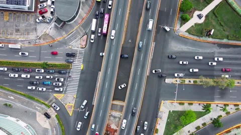 Aerial spin view of multi level interchange highway in the metropolis. Cars are Stock Footage 241450262