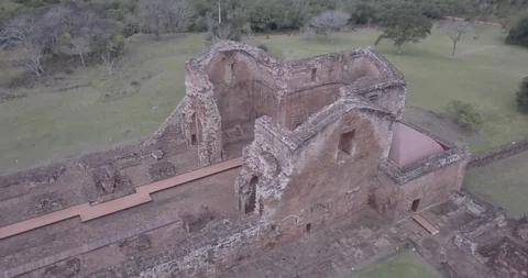Aerial spins down around the destroyed chapel of Trinidad de Parana ruins Stock-Footage 92541015