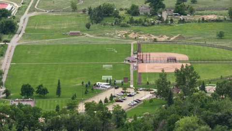 Aerial of sports complex and fields in Lyons Colorado in spring Stock Footage 337136026