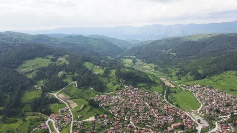 Aerial Spring view of  historical town of Koprivshtitsa, Bulgaria Stock Footage 256157553