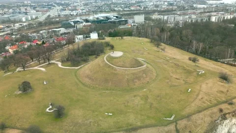 Aerial spring view of the Krakus Mound Stock Footage 233974506