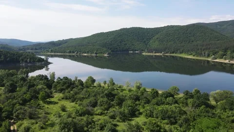 Aerial Spring view of Topolnitsa Reservoir, Sredna Gora Mountain, Bulgaria Stock-Footage 290365945