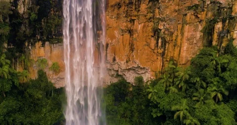 Aerial Springbrook waterfall shot from bottom to top real time in Australia Stock Footage 99743174