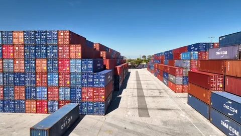 Aerial stacked shipping containers. Tariffs, tariff on imports, exports. 動画素材 305961837