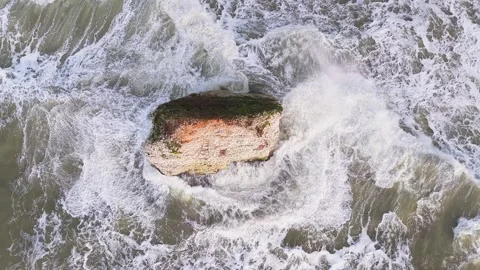 Aerial of Stag Rock sea stack and crashing waves, Freshwater Bay, Isle of Wight Stock-Footage 336105946