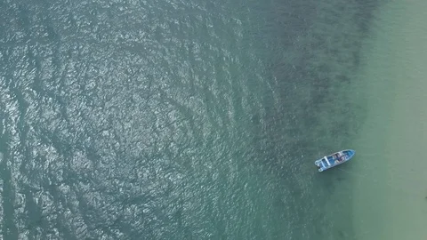 Aerial Static Drone of Boat floating in water in Tahiti, Stock Footage 92920808
