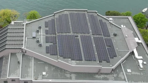 Aerial static drone shot of solar panels on rooftop Stockbeeldmateriaal 332670599