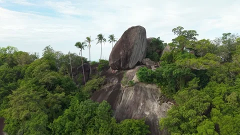 Aerial Static Shot of Granite Boulder on Jungle Hilltop Stock Footage 341214193