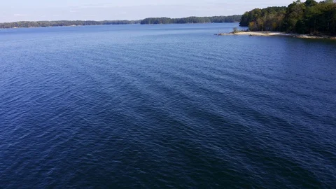 Aerial static shot over blue lake waters. Stock Footage 119298769