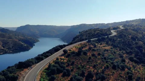 Aerial Static Shot of a Road Next to a River. No traffic. 스톡 동영상 152304344