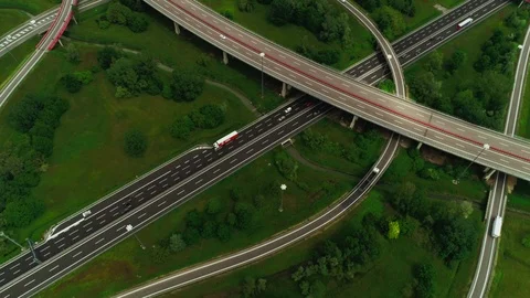 Aerial static shot top view modern multi level highway with winding circle ring Stock Footage 111220743