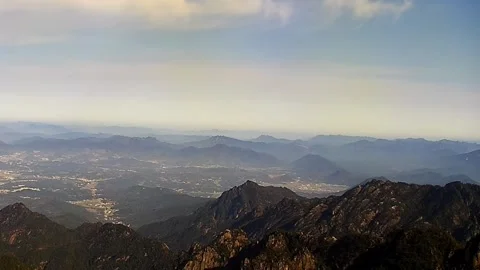 Aerial Static Time-lapse of Fast Moving Clouds Over Erhai Lake and Cangshan Stock Footage 329348270
