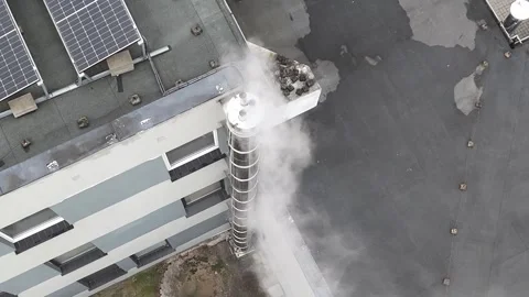 Aerial Static Top Down View of Smoking Chimney on Roof Stock Footage 323965033