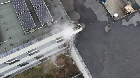 Aerial Static Top Down View of Smoking Chimney on Roof Stock Footage 323965062