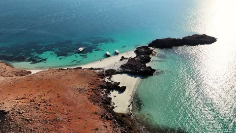 Aerial Static View of Boats Moored Near Rocky Island, Daymaniyat Islands Oman Stock Footage 333477522