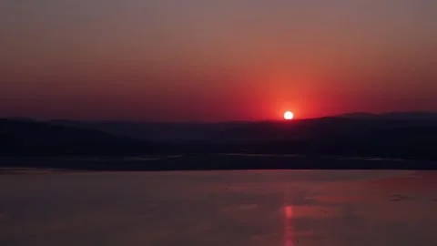Aerial Static View of Red Sun Sunset Over Chinese River 库存影片 332687700