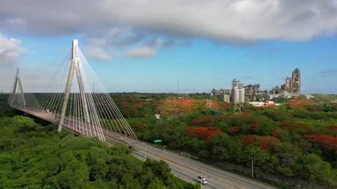 Aerial static view of suspension bridge and cement plant in the background. Cars Stock Footage 246041012