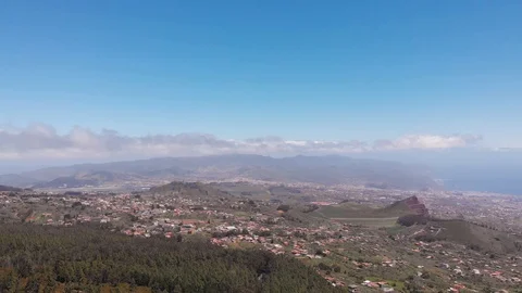 Aerial static view - valley and distant mountains, clouds and ocean, Tenerife Stock Footage 110894681