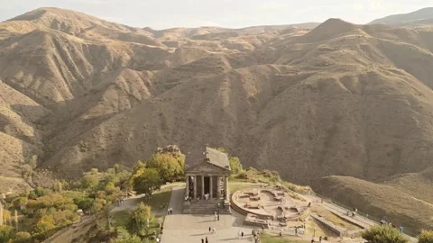 Aerial static view visitors by The Garni Temple - classical colonnaded stru.. Stock Footage 292894699