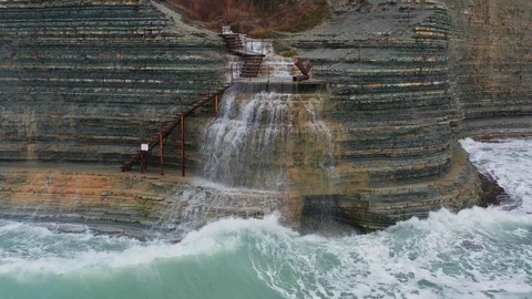 Aerial  static view of waterfall,  along Steep Cliffy Coast on Black Sea Video stock 101130830
