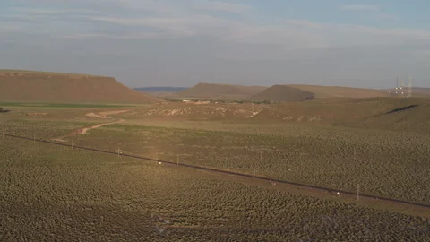 Aerial of Steens Highway through Eastern Oregon surrounded by high desert hills Stock Footage 311942317