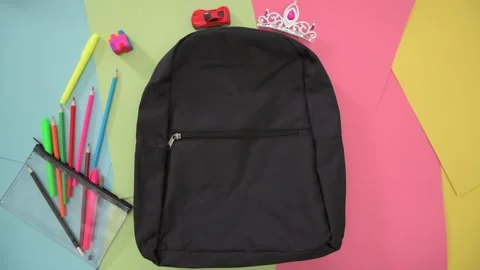 Aerial Stop-Motion Packing School Bag Colourful Background Stock Footage 158236728