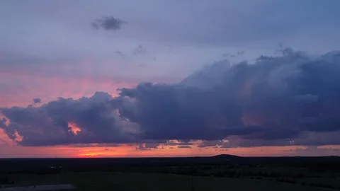 Aerial of a storm cloud at sunset Stock Footage 106022444
