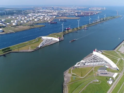 Aerial storm surge barrier panning left showing Maeslantkering 4k Stock Footage