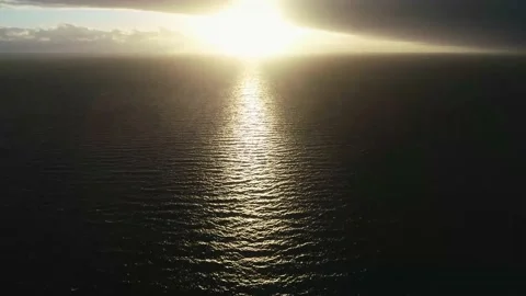 Aerial of a stormy Sunset with Kite Surfers over Indian Ocean Stock Footage