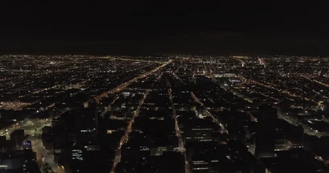 Aerial strafes to the left while looking out west in Bogotá, Colombia at night Vídeos de archivo 99478022