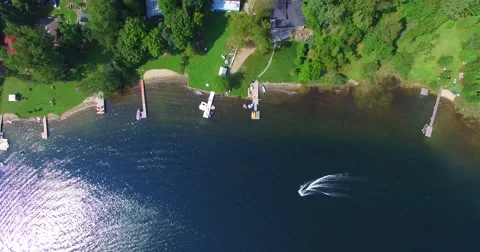Aerial Straight down Fly over Lake and cottages in summer 4k Stock Footage 54568068