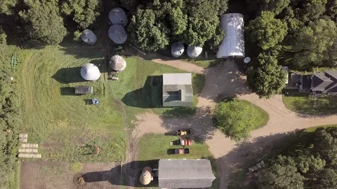 Aerial straight down view of a farmstead with barns Stock Footage 113016825