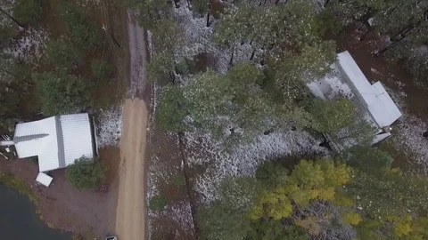 Aerial straight down view of mountain cabins in the forest Stock Footage 96780092