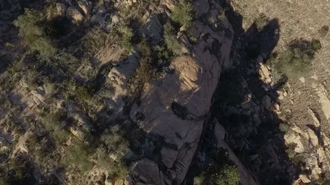 Aerial straight down view of rugged desert boulders and rock spires Stock Footage 98489233