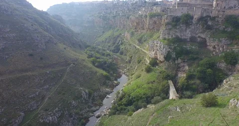 Aerial of stream passing through cliff Stock Footage 89971749