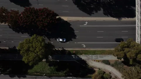 Aerial street traffic with small bridge top down side pan Stock Footage 164886053