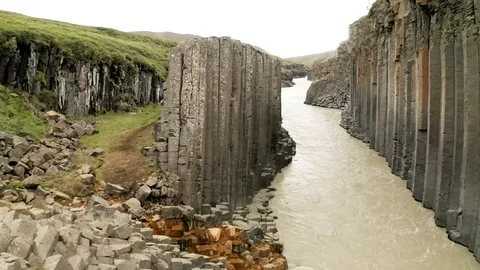 Aerial of Studlagil river with basalt formations hills, Iceland Stock Footage 120489465