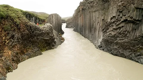 Aerial of Studlagil river with basalt formations hills, Iceland Stock Footage 120489551