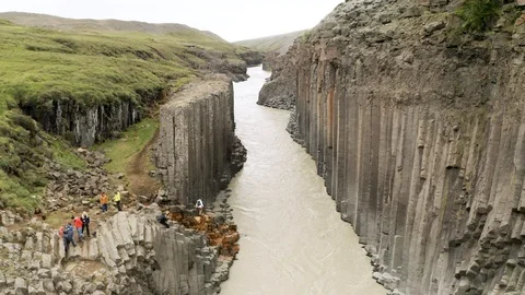 Aerial of Studlagil river with basalt formations hills, Iceland Stock Footage 120489561