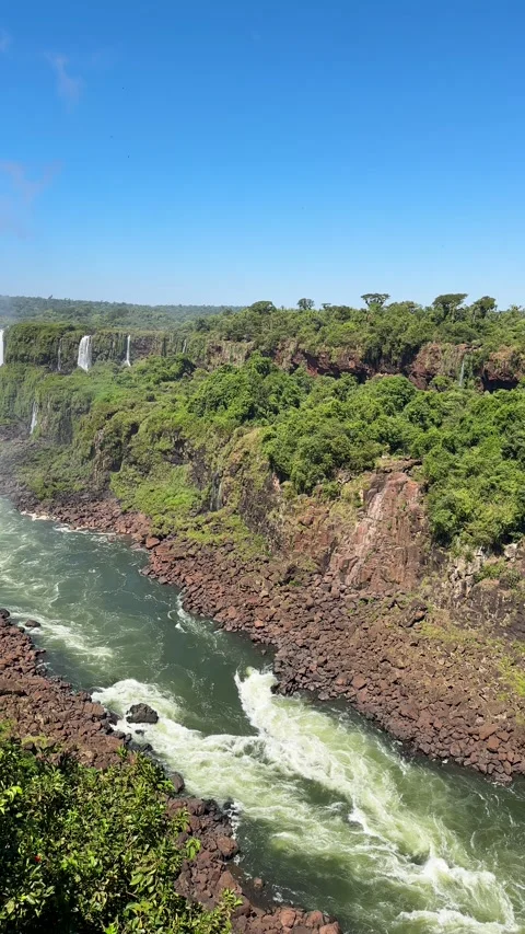 Aerial-style drone footage capturing the breathtaking Iguazu Falls Stockbeeldmateriaal 343437083
