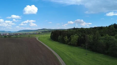 Aerial summer landscape with forests, fields and rolling countryside Stock Footage 336576081