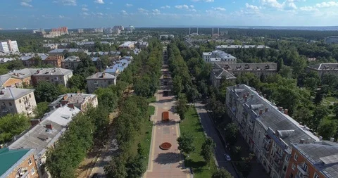 Aerial summer townscape with tree-lined walkway and residential area, Russia Stock-Footage 122041680